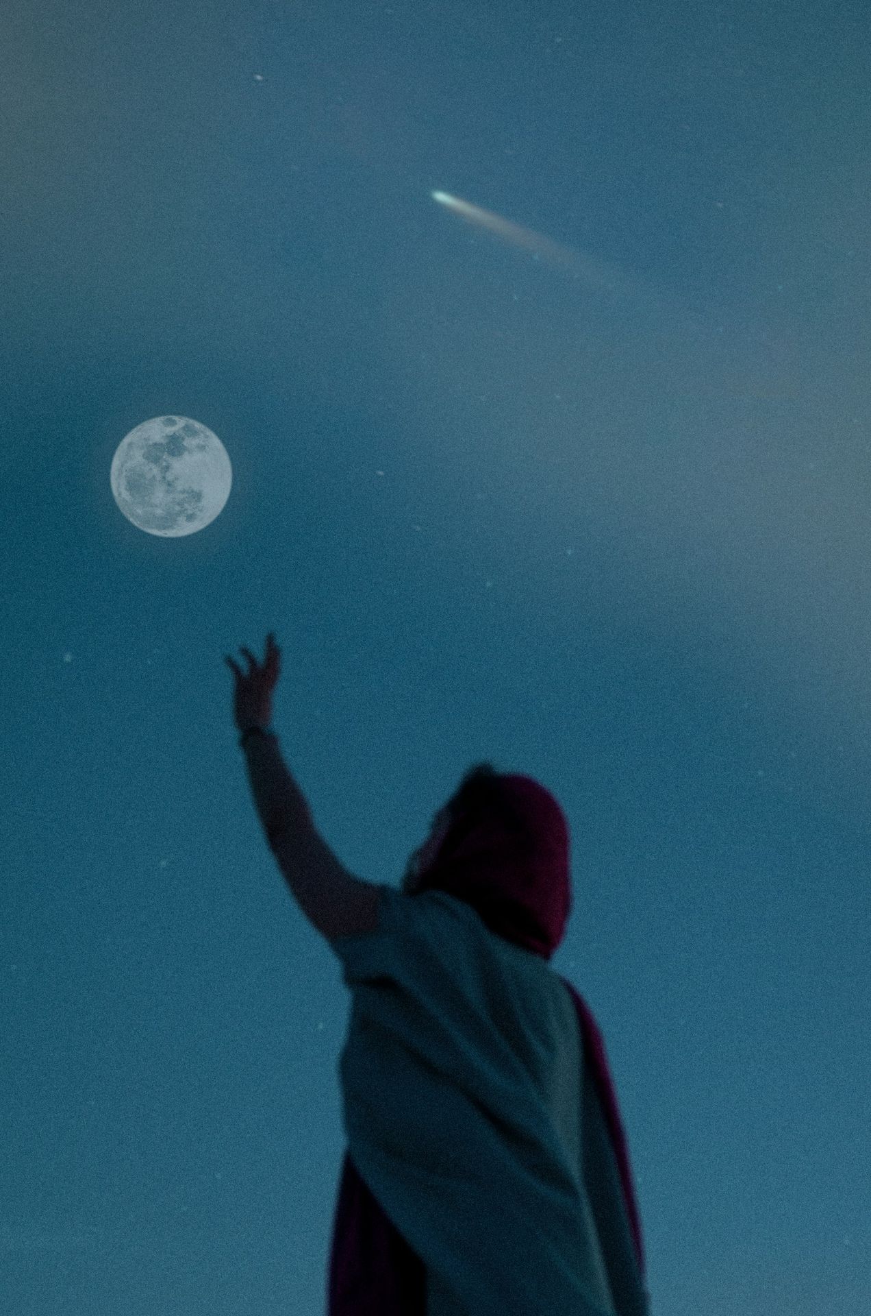 person in red hoodie looking at moon